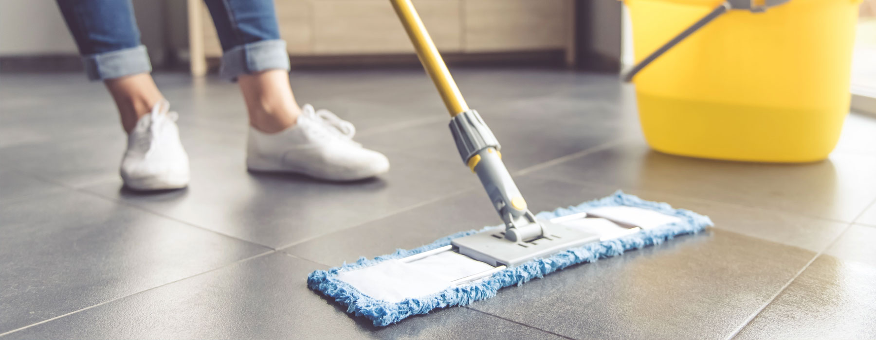 Cleaner mopping the floor